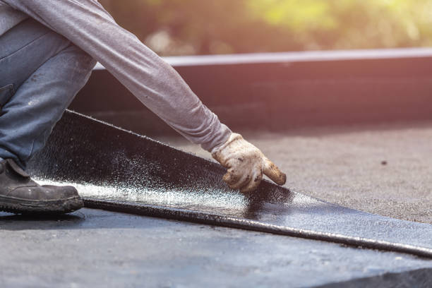 Professional Waterproofing technician working in Fishers, NY